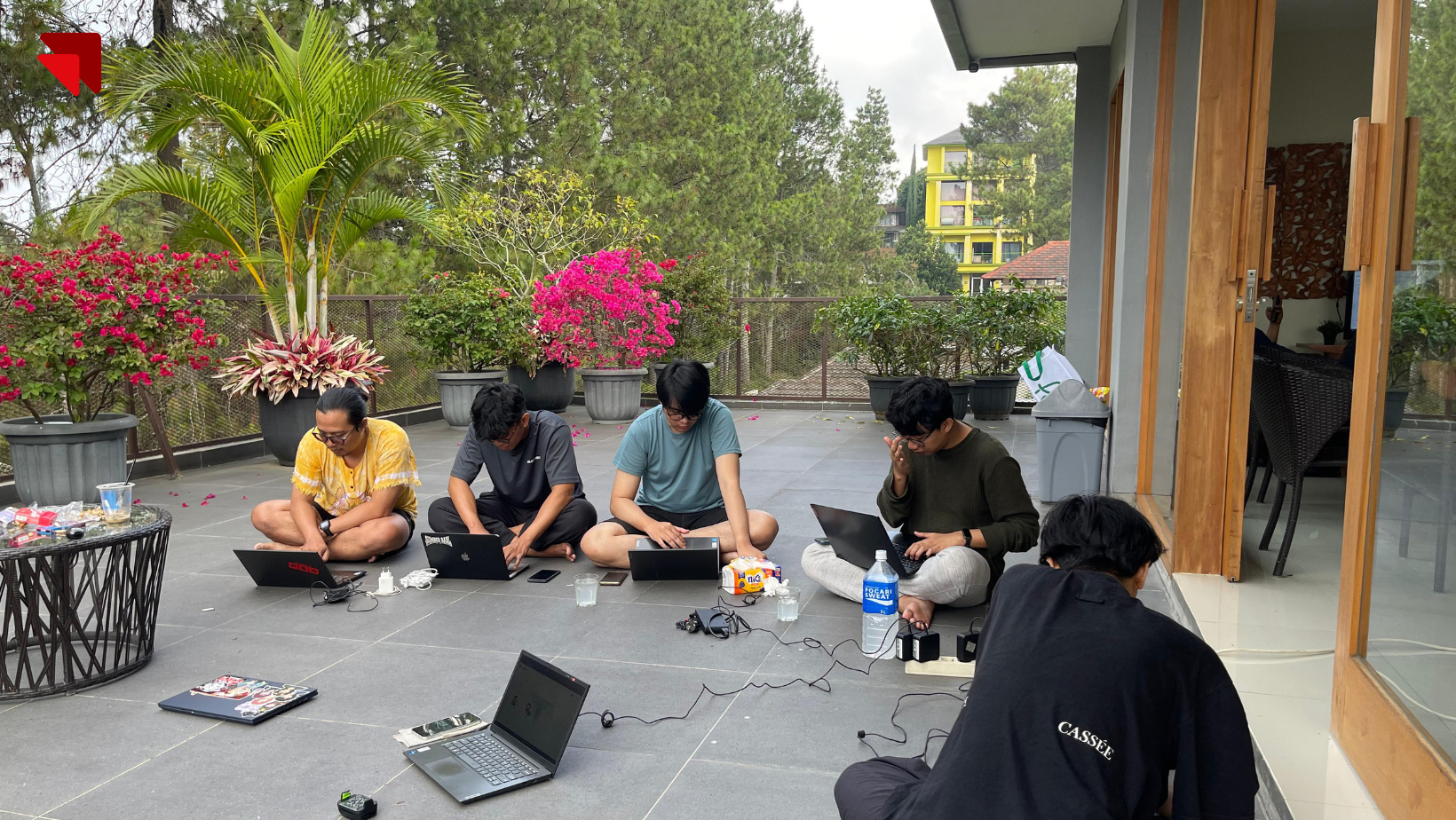 Emveep team coordinating the launch plan for BPK PENABUR’s online admission platform in a relaxed team setting.