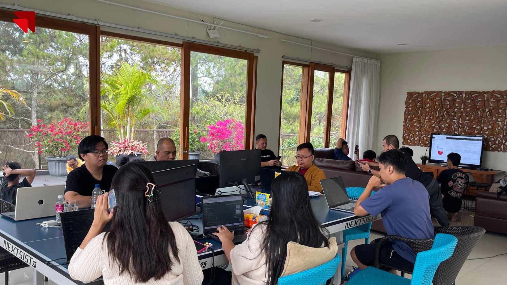 Alternate view of Emveep's development team working on backend infrastructure for BPK PENABUR Jakarta’s digital platform.